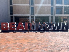 Beardown sign with conference attendees