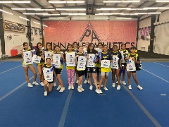 Youth cheerleaders pose with Arizona Wildcat towels