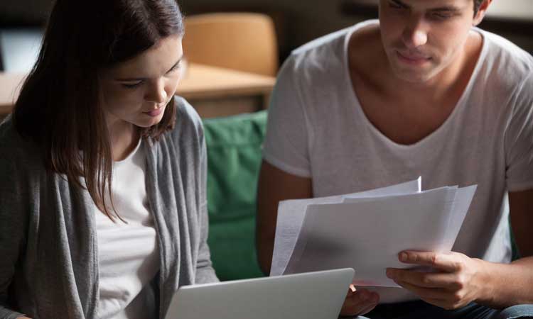 Young couple reviewing mortgage application